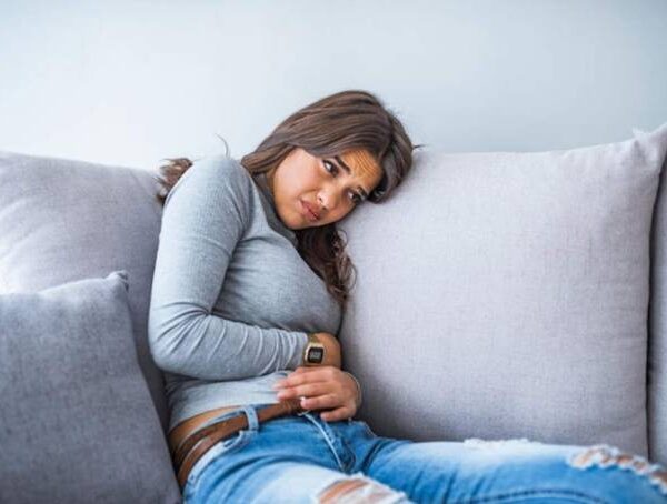 Woman experiencing digestive problems and abdominal discomfort