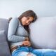 Woman experiencing digestive problems and abdominal discomfort